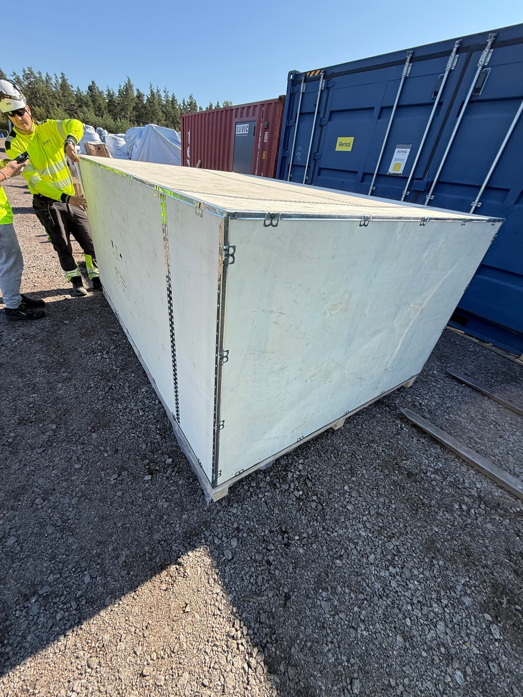 Pallets with delivered components in a row