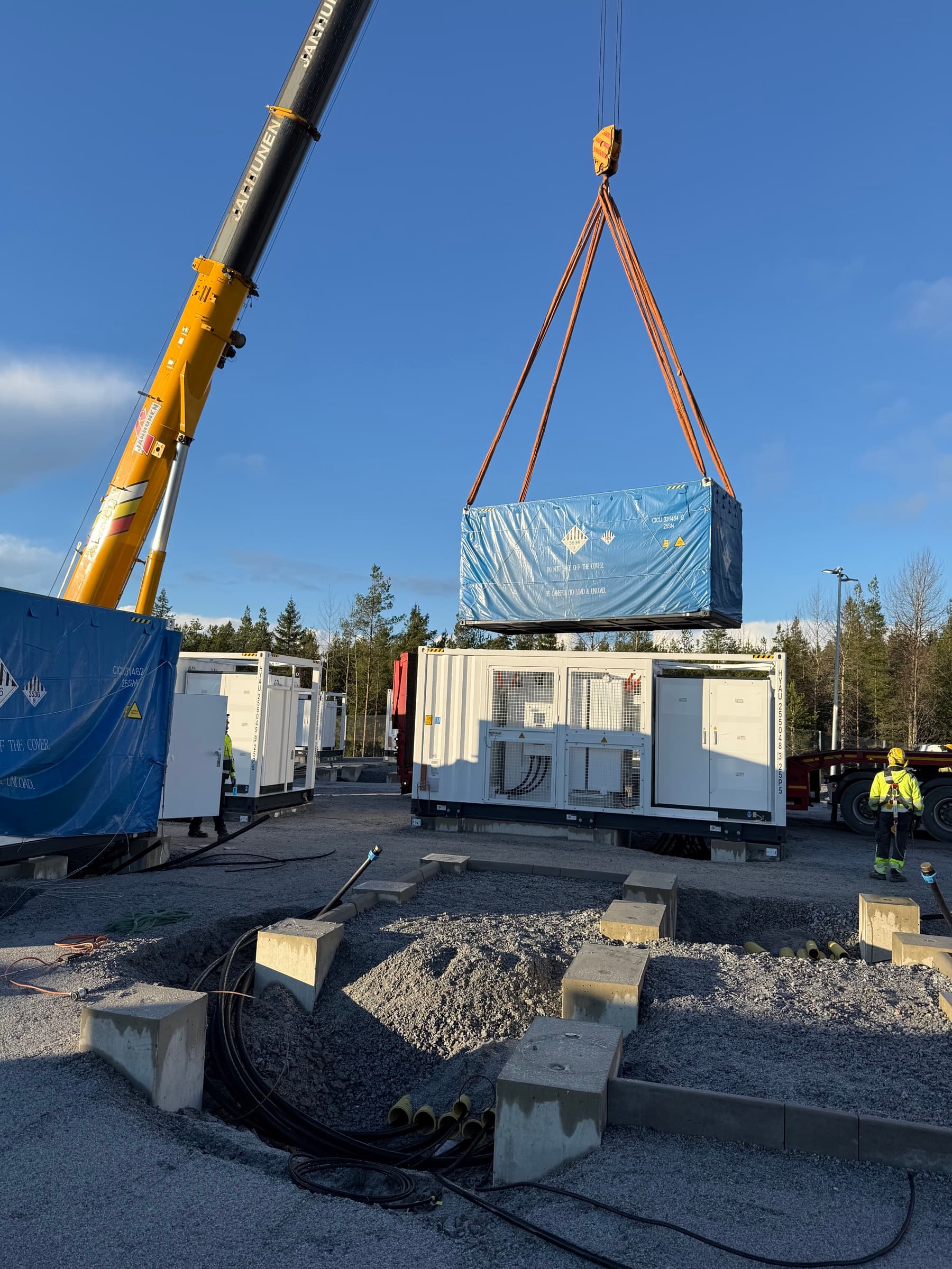 Crane lift of Sungrow battery container at battery park in Kalanti, Finland